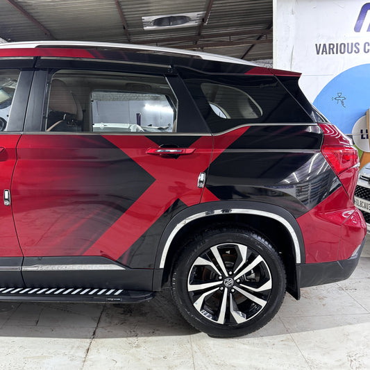 Big x custom car graphic wraps on a stylish red and black SUV with sleek design