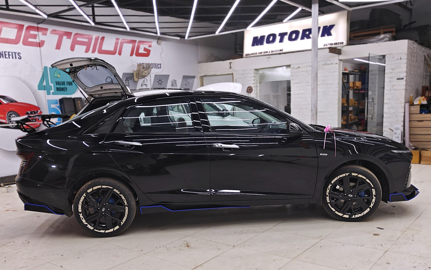 Black car featuring Black Beast tyre stickers for enhanced style and customization