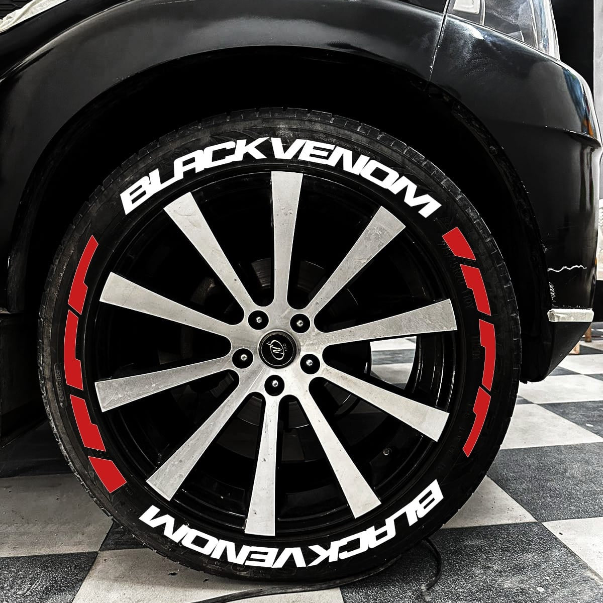 Black Venom Tyre Stickers on stylish alloy wheels for a sporty automotive look