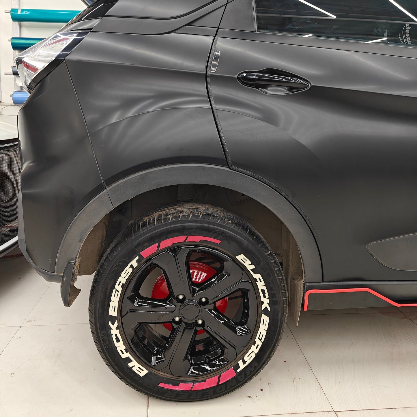 BlackBeast tyre stickers on a stylish black SUV with glossy black wheels