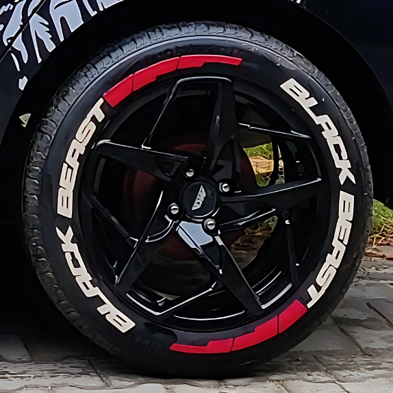 BlackBeast tyre Stickers on stylish black alloy wheels for enhanced vehicle aesthetics