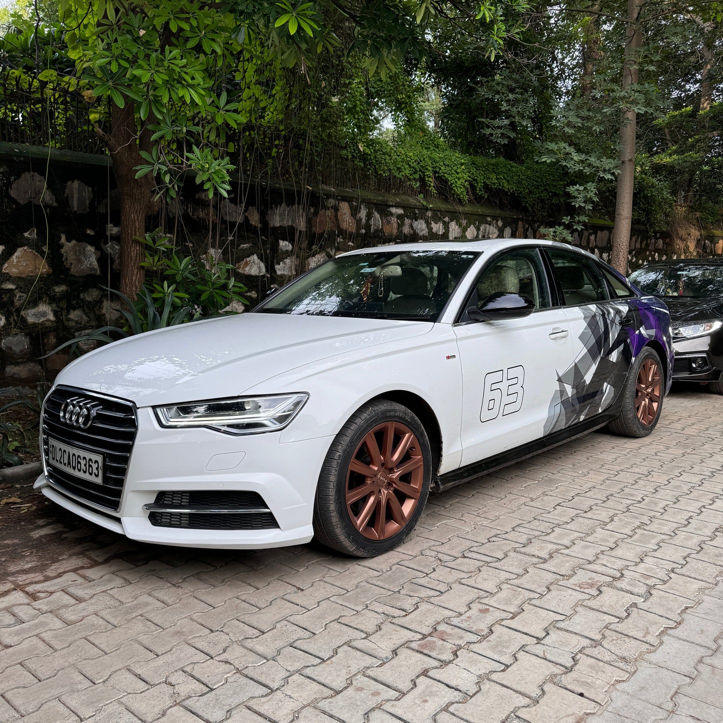 Audi sedan with stylish car side and rear graphics decals showcasing a modern design