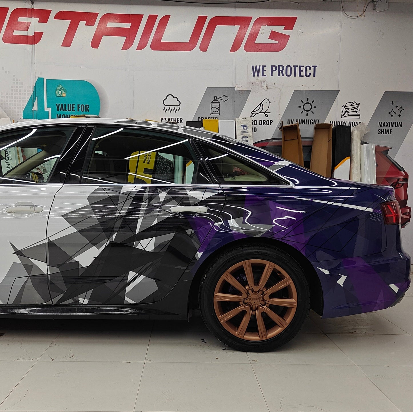 Sedan car side and rear graphics decals featuring abstract geometric designs in purple and black