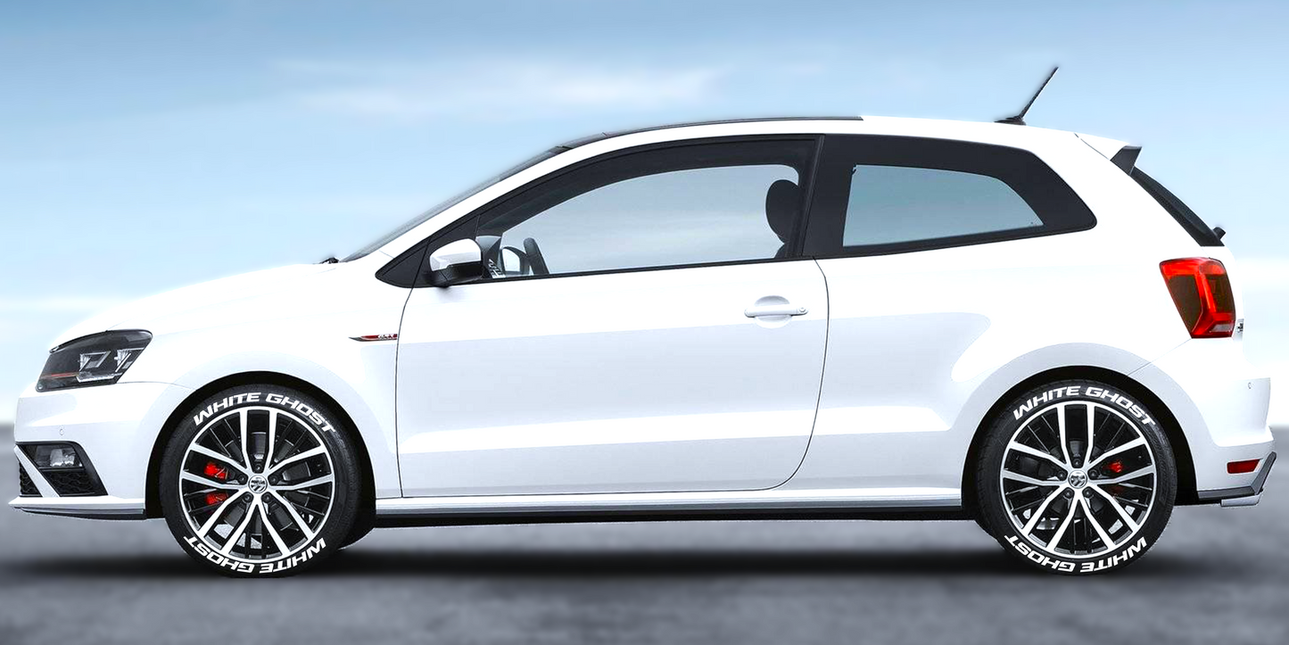 White car featuring a custom tire stickers set on stylish black alloy wheels