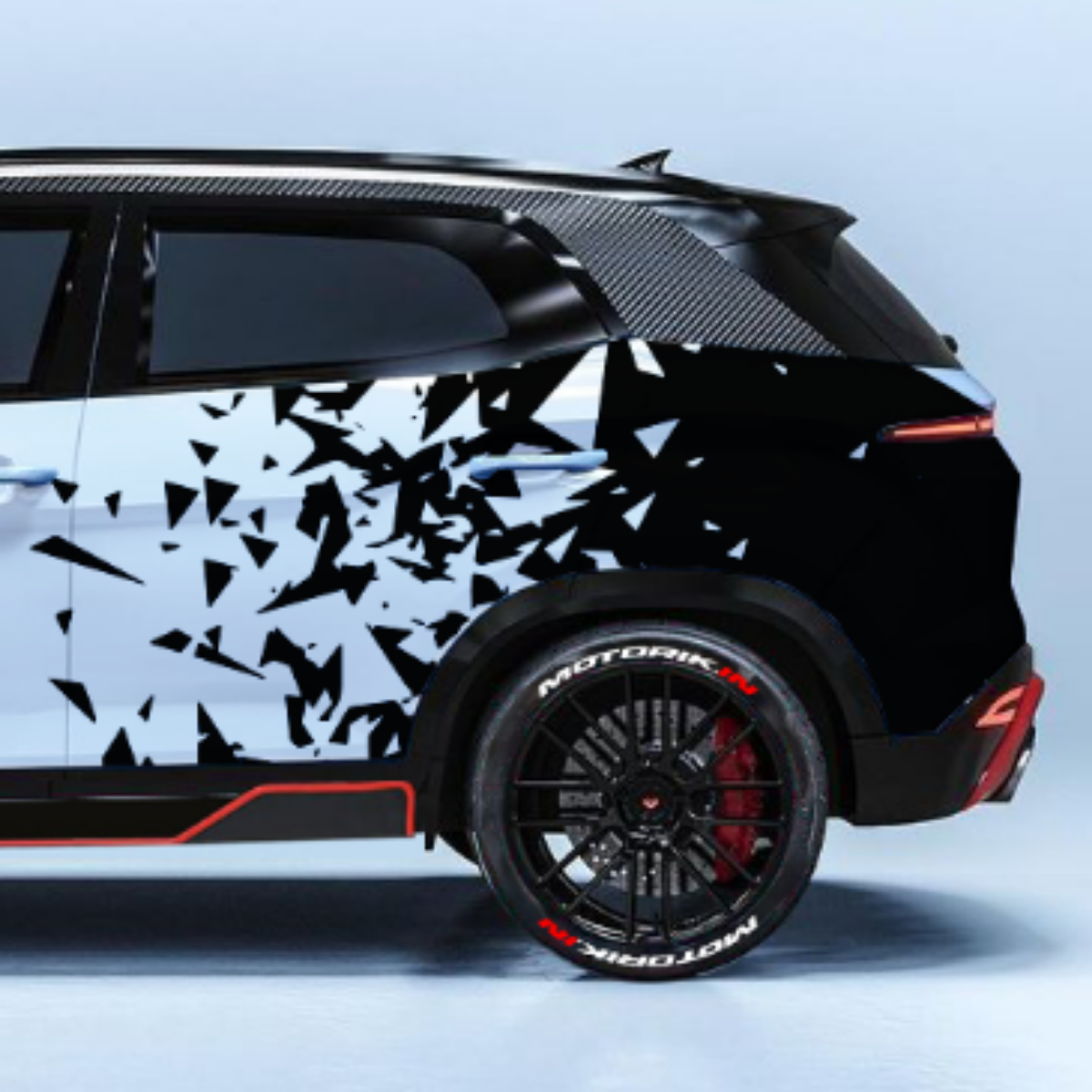 Stylish diamond cut car graphics on a sleek SUV with black and white bold design