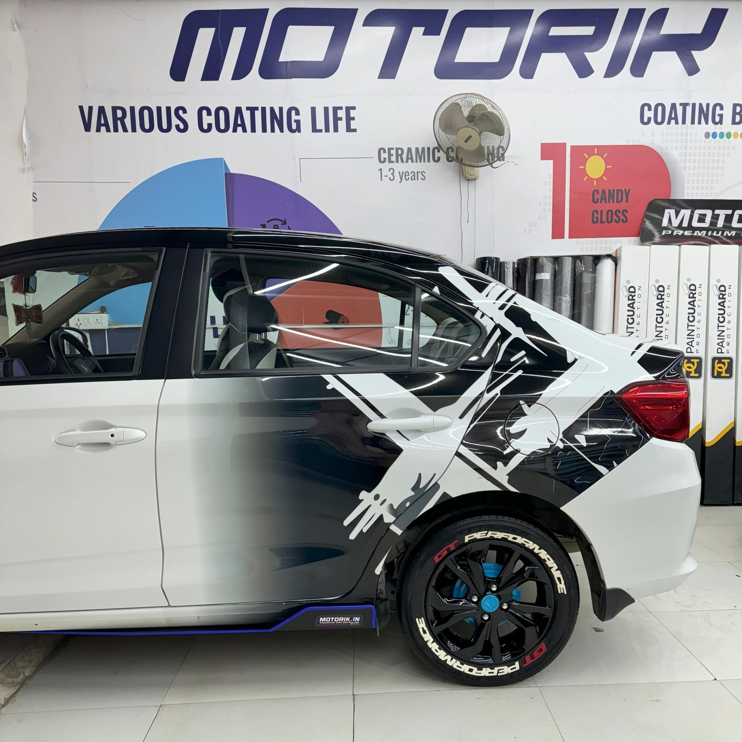 Double X graphics for vehicles on a sleek white car enhancing its sporty appearance