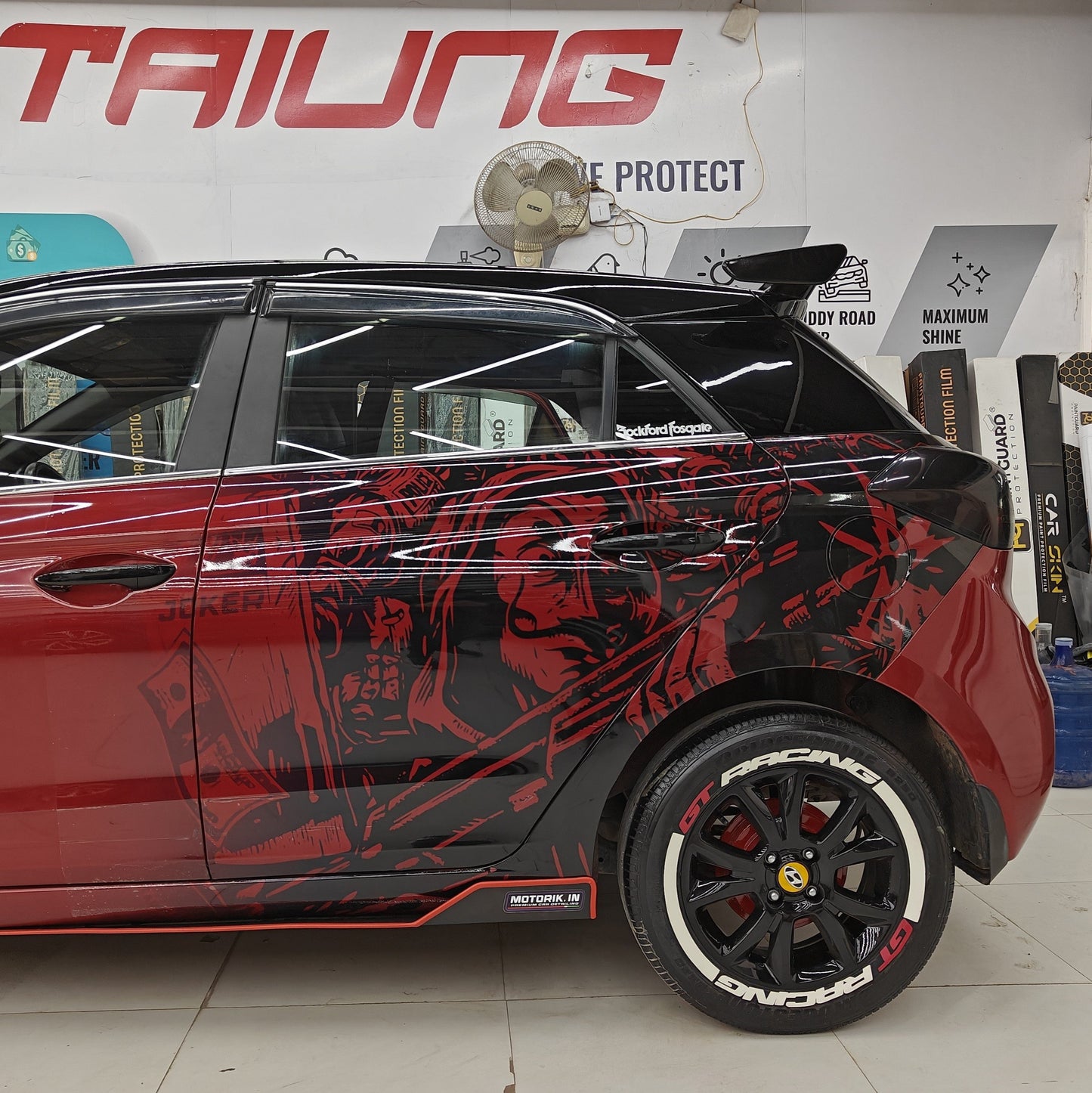 GT Racing tire stickers applied on a sporty black car for enhanced style and performance
