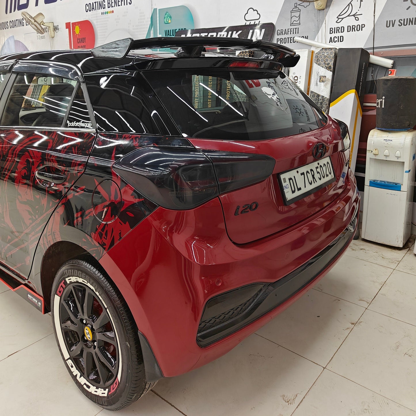 GT Racing tire stickers on a red car with a sporty design and rear spoiler for enhanced style