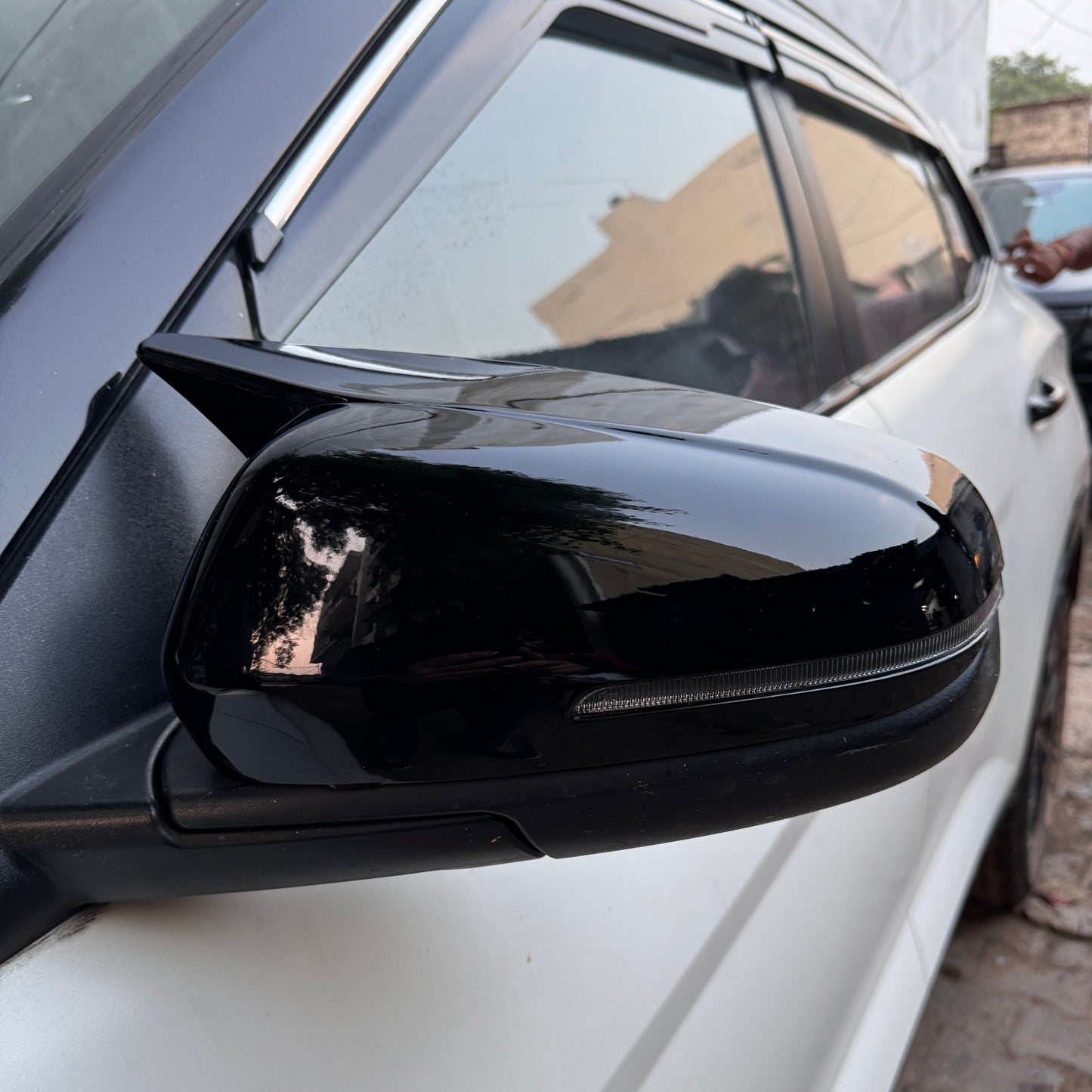 Hyundai Verna 2023 mirror cover in glossy black, enhancing the vehicle's stylish appearance