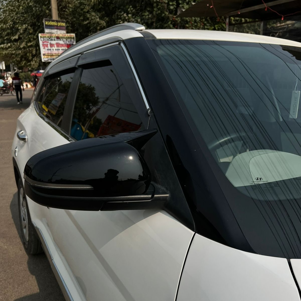 Hyundai Verna 2023 mirror cover in black, enhancing the vehicle's sleek design and protection