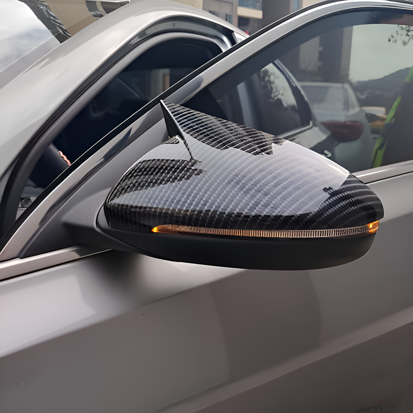 Hyundai Verna 2023 mirror cover in carbon fiber finish with integrated turn signal lights