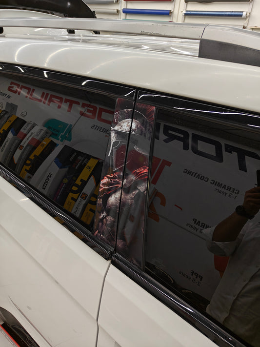 Iron Samurai car graphics on a vehicle window, enhancing the sleek look of vehicle detailing