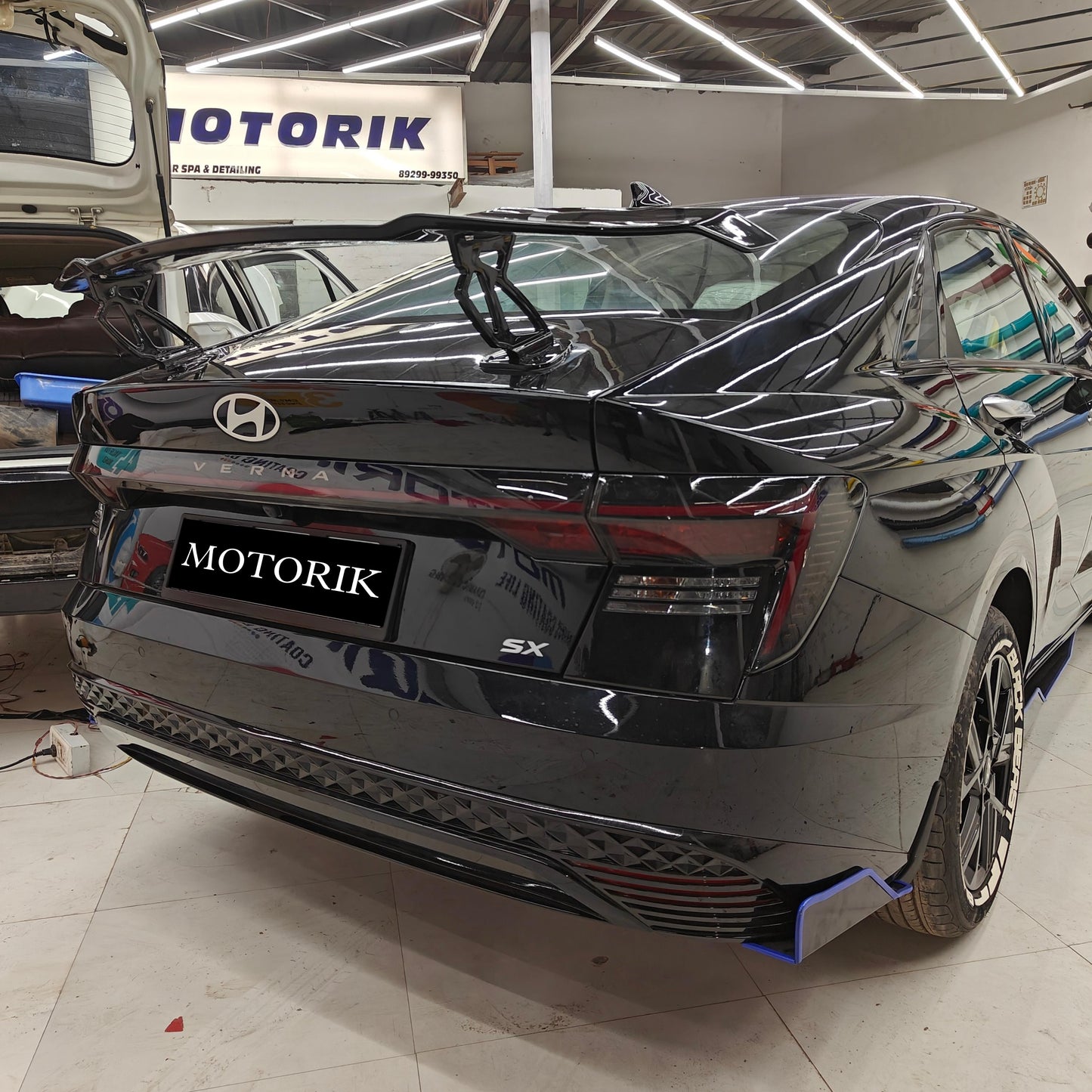 Black Hyundai sedan with a stylish rear car spoiler for sedans by Motorik Detailing