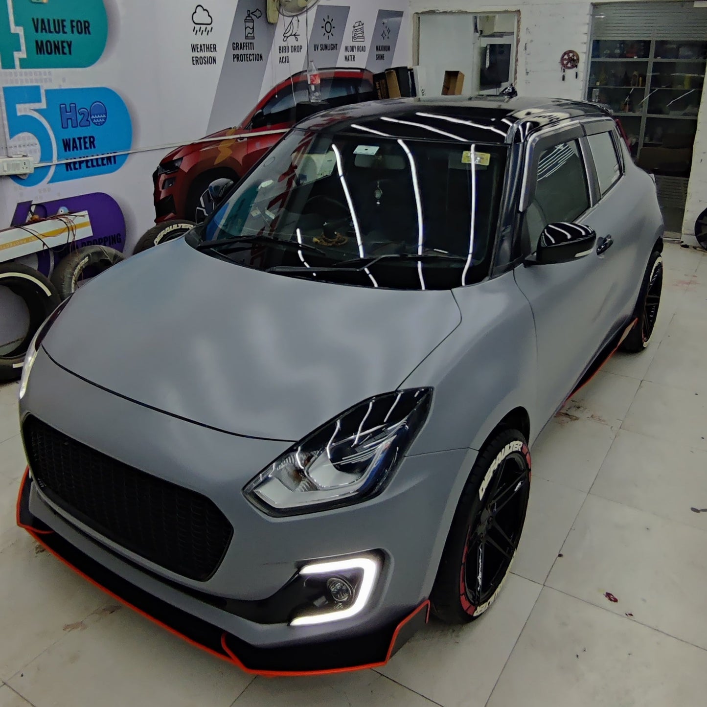 Defaulter car tyre sticker on a sleek grey car with stylish features at Motorik Detailing shop