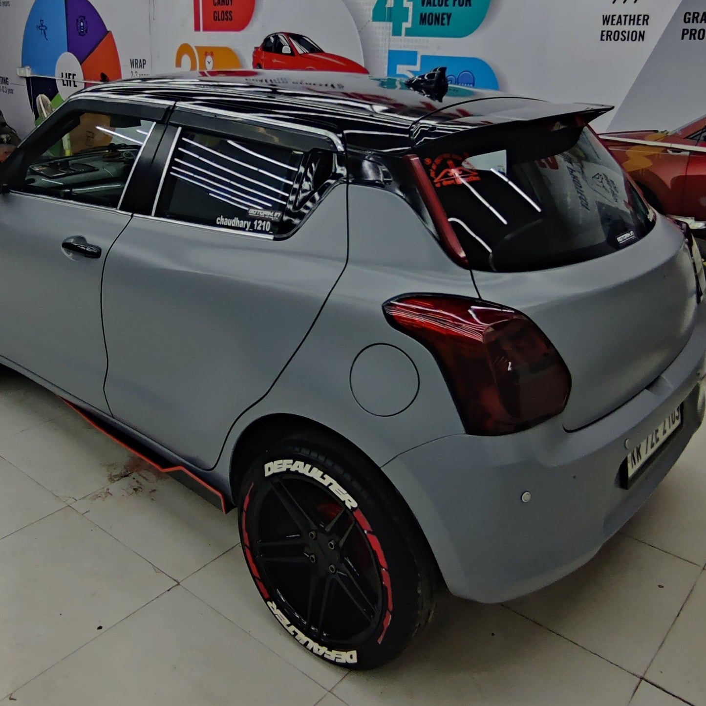 Defaulter car tyre Sticker on stylish black wheels of a custom car with a sleek design