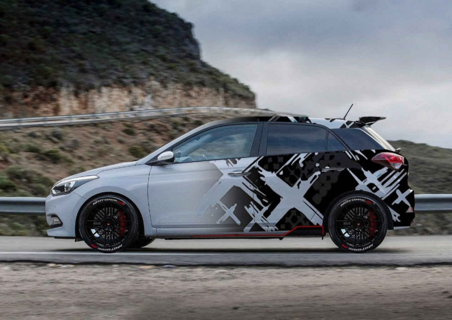 Motorik Multi-X graphics on a silver car showcasing a sleek modern design with black accents