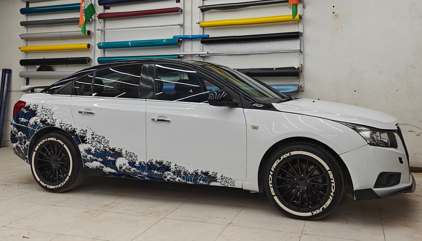 Stylish Sedan Car with Ocean Theme Car Sticker Featuring Wave Designs in Blue and White