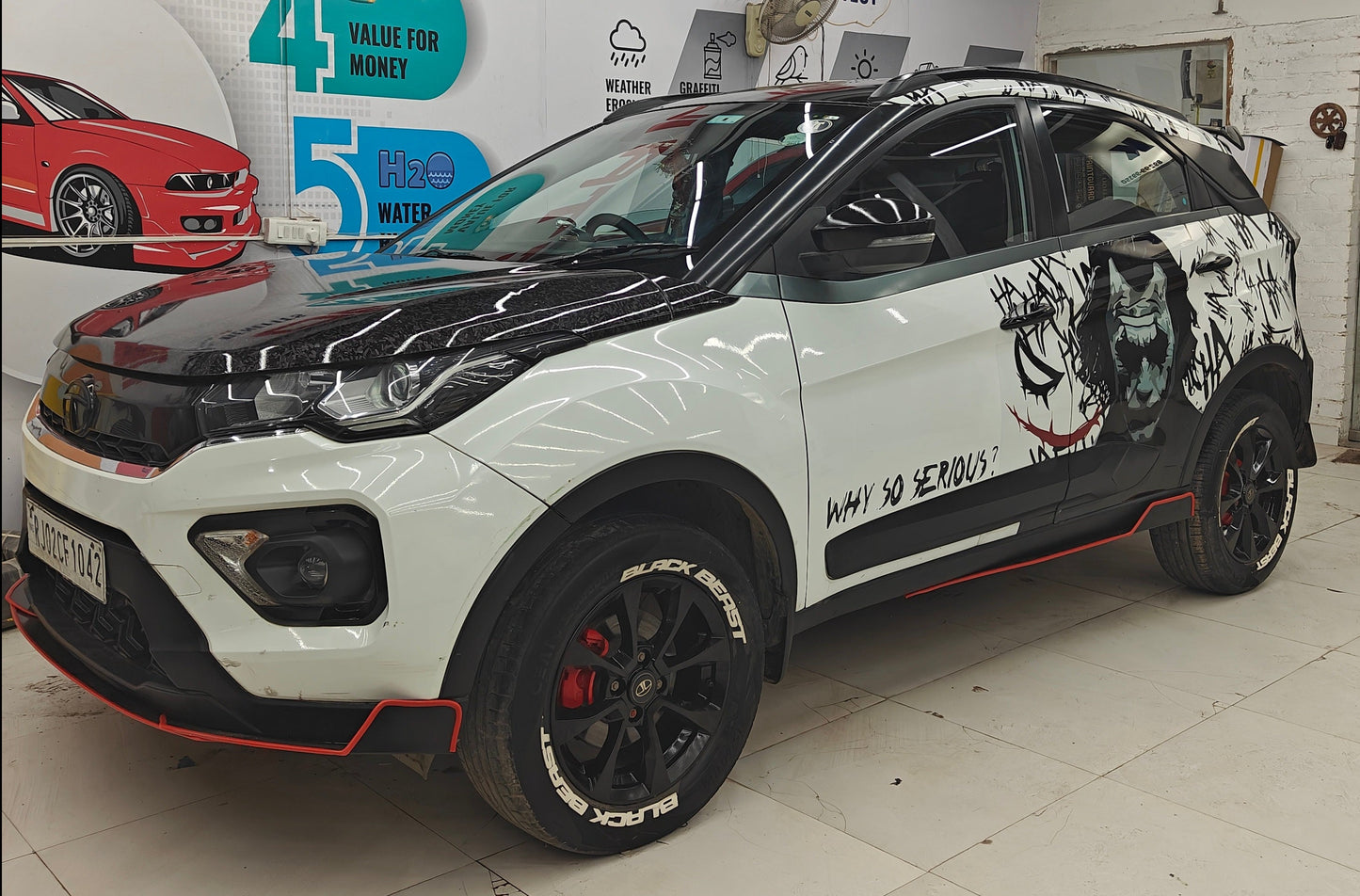 Motorik Detailing Tyre Sticker on Custom Black and White Car with Graphic Design