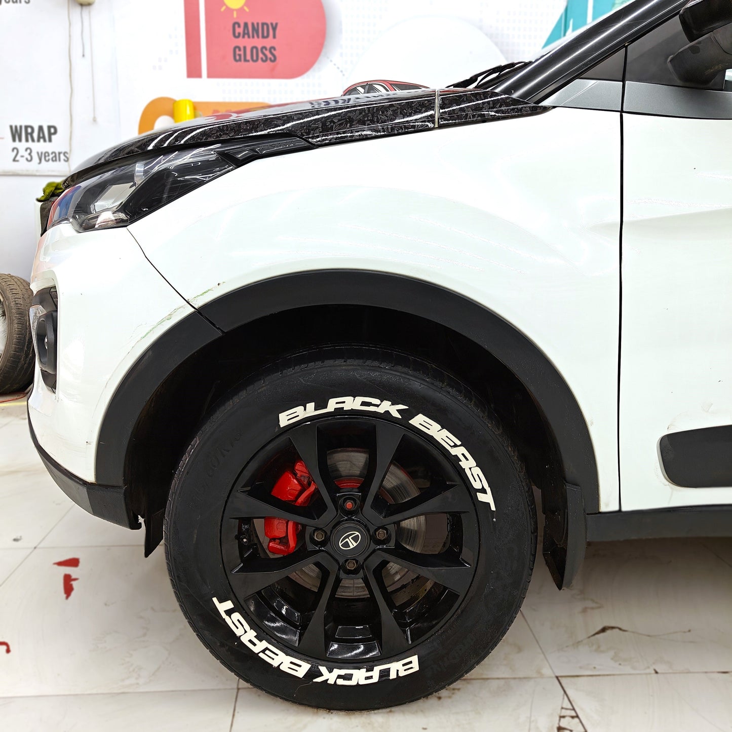 Motorik Detailing Tyre Sticker 'Black Beast' on a White Car Tire for a Stylish Look