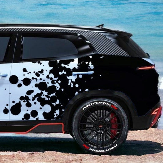 Stylish particle distortion car graphics on a sleek SUV, showcasing a modern design by Motorik Detailing