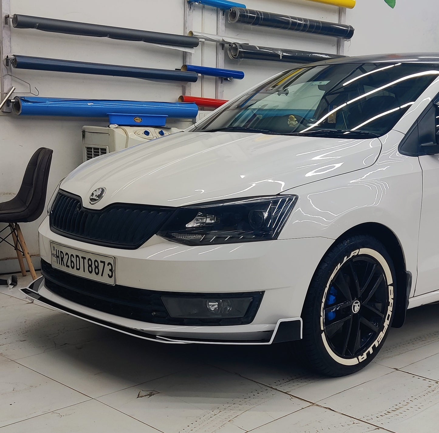 Skoda bumper protectors set displayed on a white Skoda car in detailing workshop
