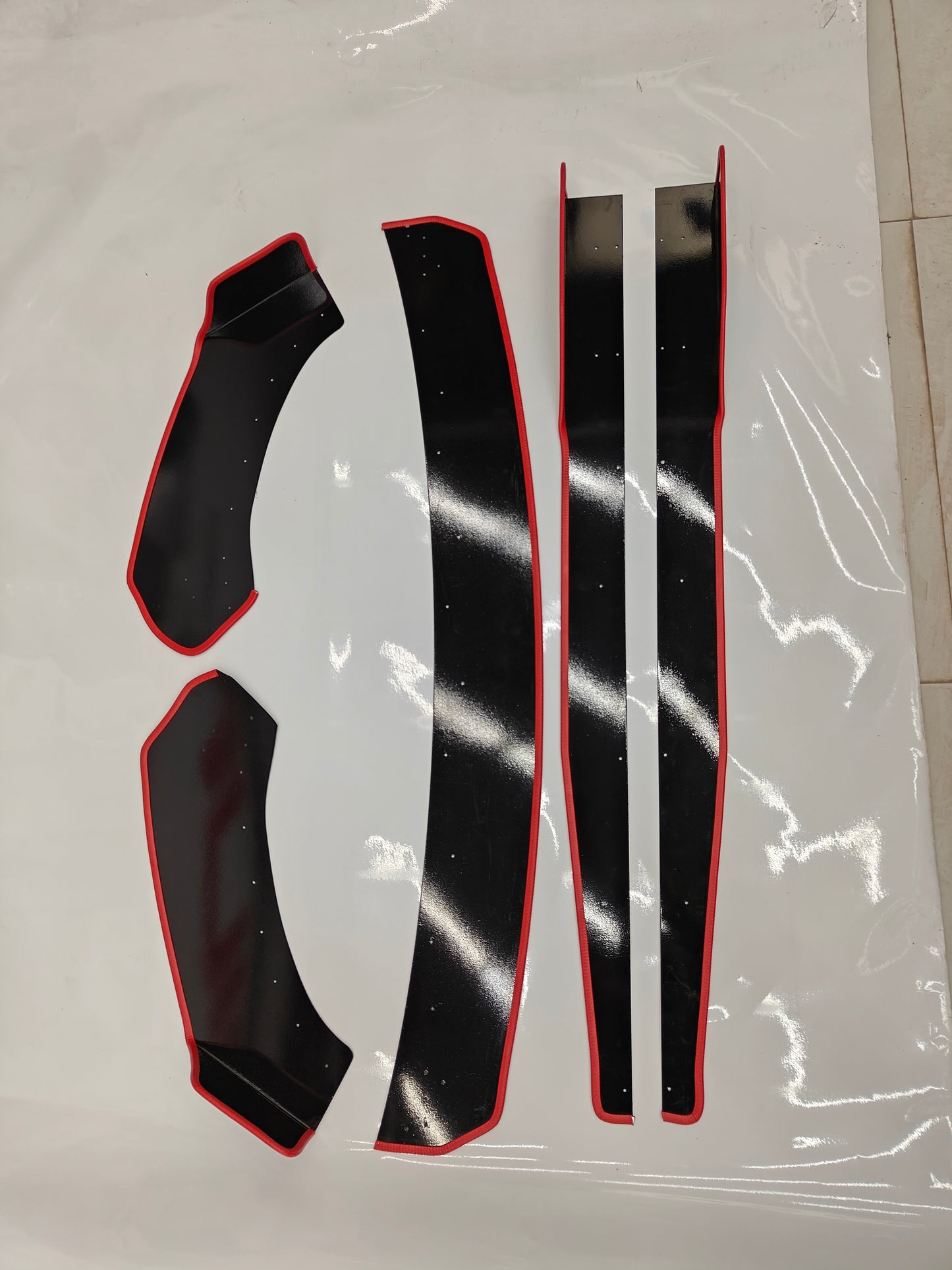 Set of 5 Motorik Detailing Skoda Slavia splitters with a sleek black finish and red accents