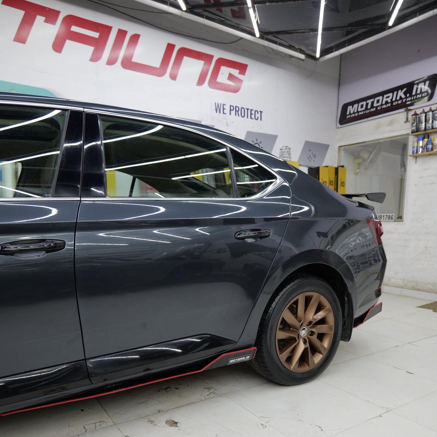 Set of 5 Skoda Slavia splitters installed on a sleek grey Skoda vehicle for enhanced styling