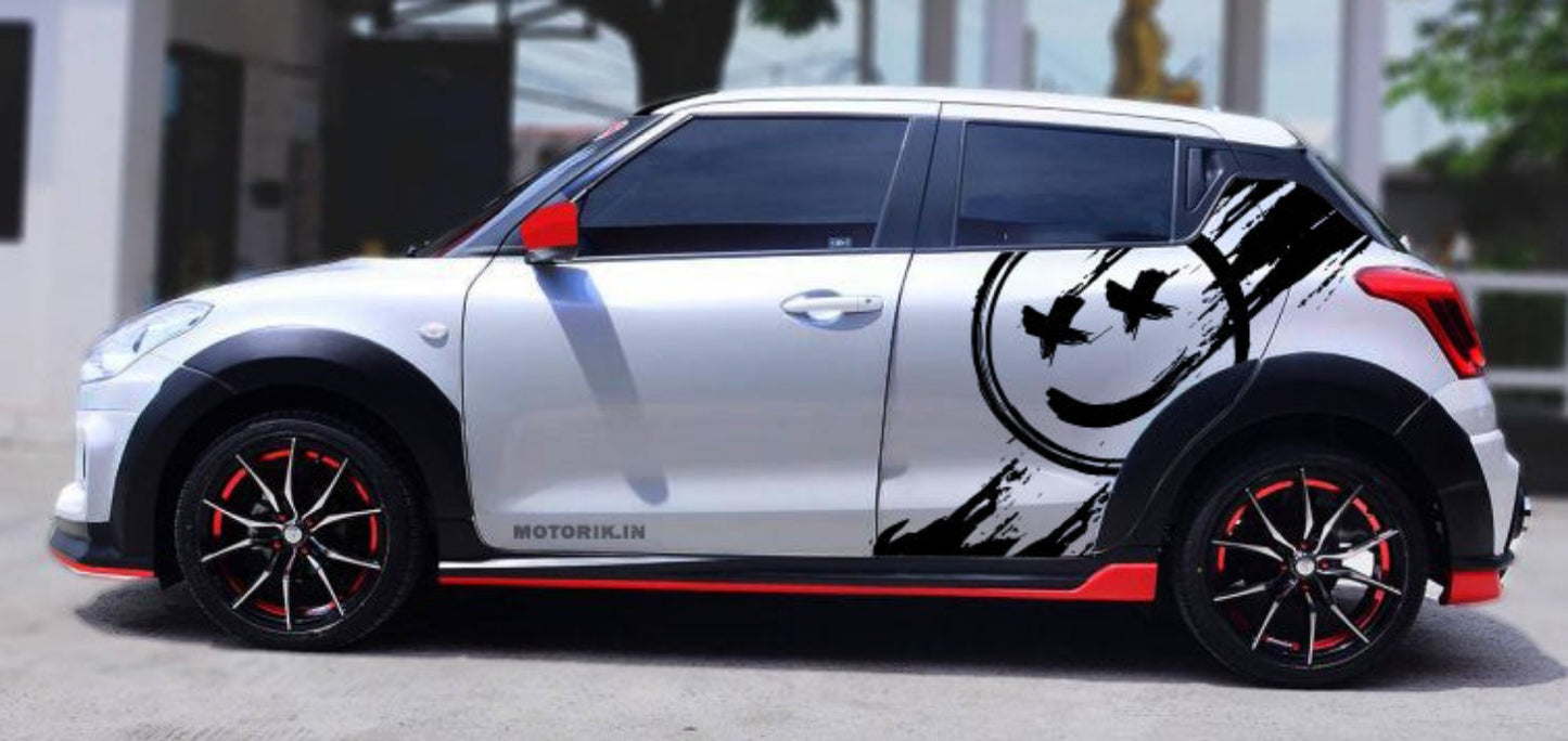 Stylish hatchback car with smile car graphic design, featuring bold black accents on a silver finish