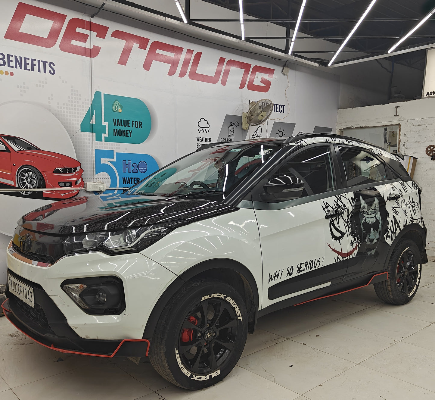 TATA car skirting kit applied to a black and white vehicle with custom graphics