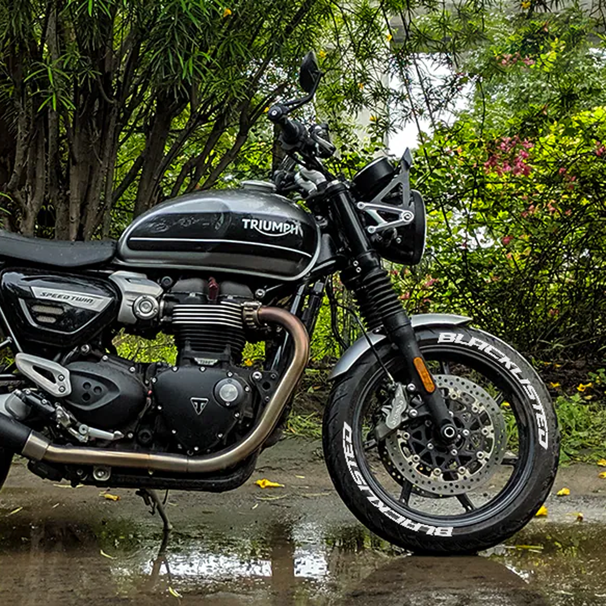 Triumph motorcycle featuring BLACKLISTED bike tire stickers for a bold, custom look.