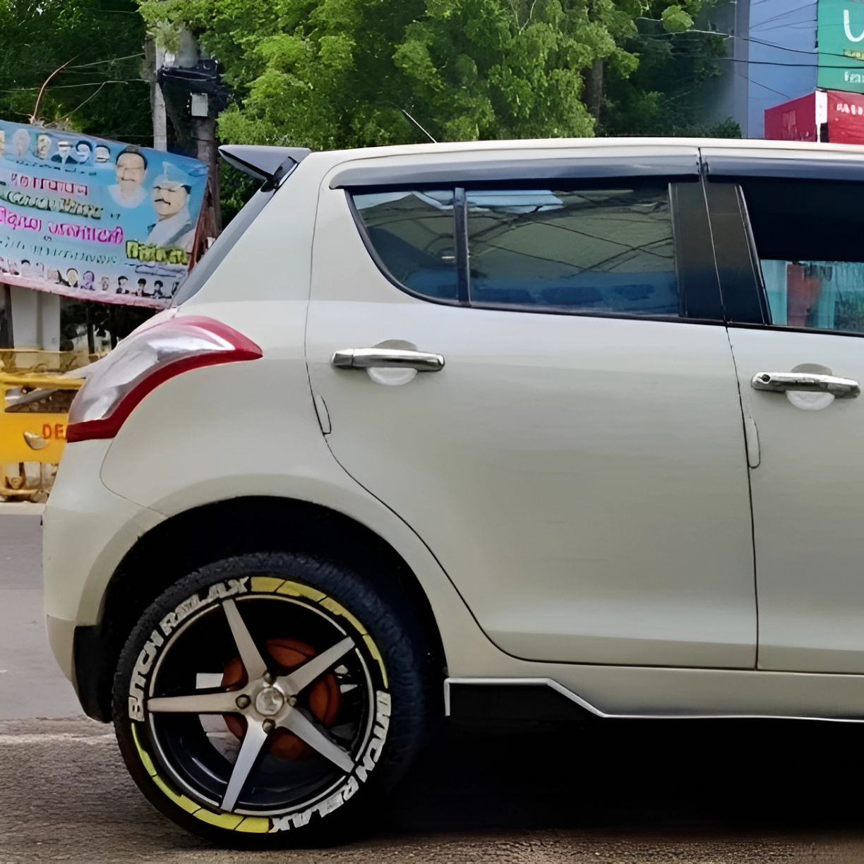 Stylish car with wheel tyre stickers set in white, enhancing the sporty look of the vehicle