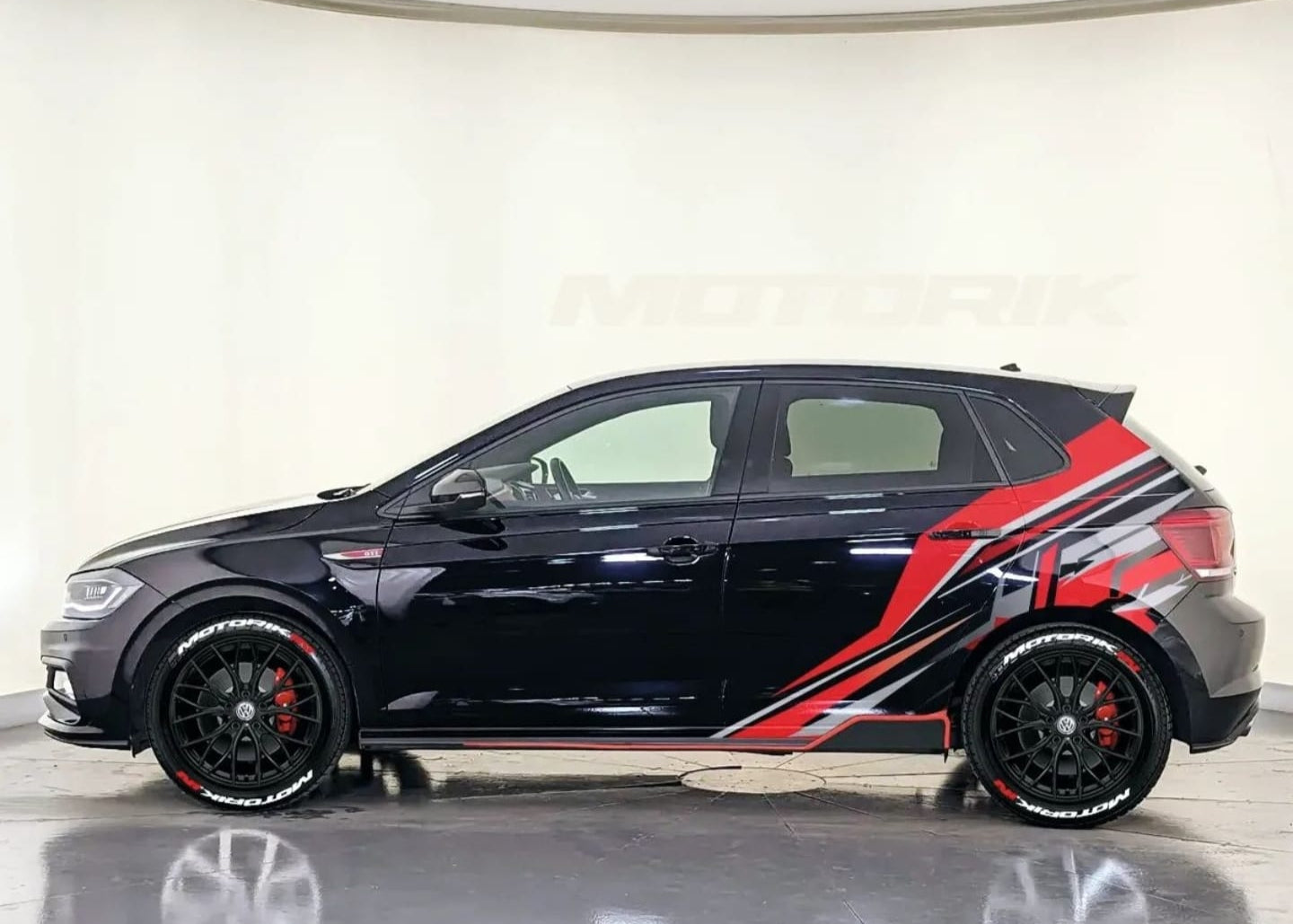 Motorik Detailing Abstract Car Graphic Hatchback in black with red and silver side graphics