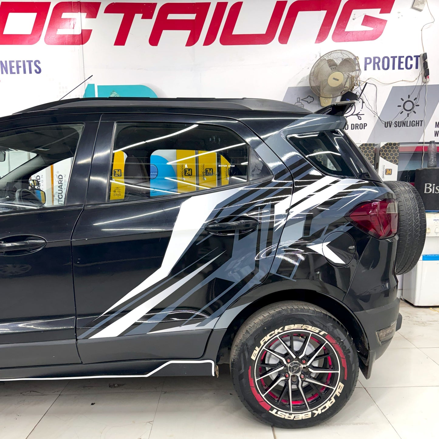 Stylish abstract car graphic hatchback design on a black car for a sportier look