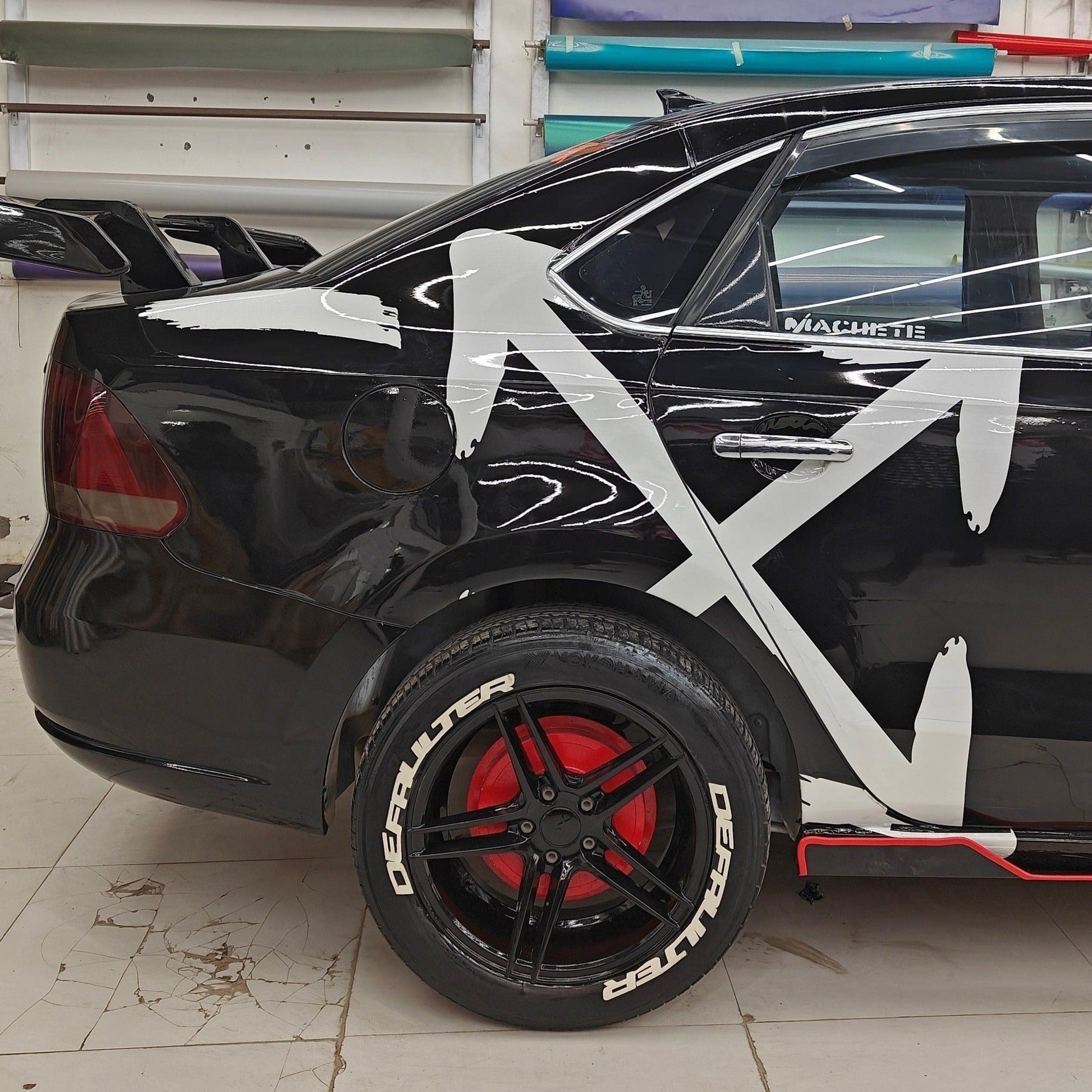 ARROW X car graphics on a black vehicle with stylish design and red accents