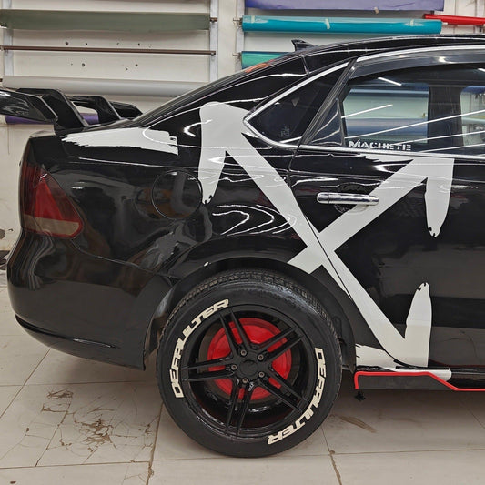 ARROW X car graphics on a black vehicle with stylish design and red accents