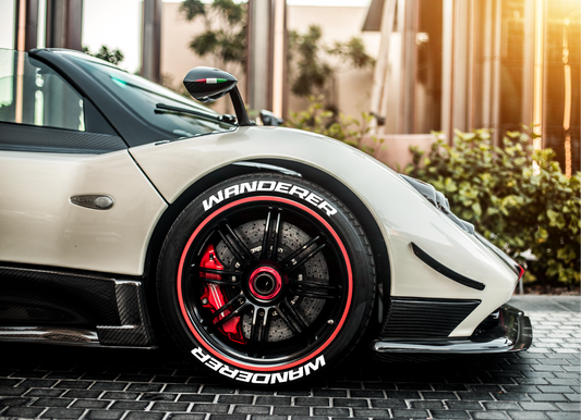 Custom car tire stickers on a stylish sports car with a sleek design and vibrant metallic rims