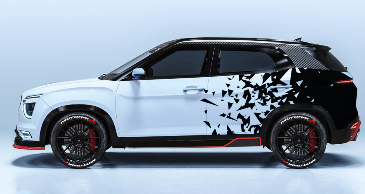 Stylish vehicle with diamond cut car graphics featuring a dynamic black and white design
