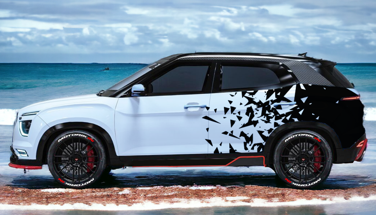 Stylish electric SUV with diamond cut car graphics in black and white at beach
