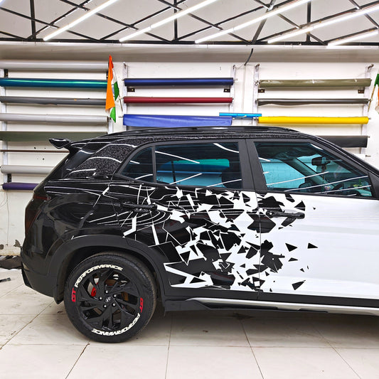 Black and white car with Distortion car Graphics featuring angular designs and striking patterns