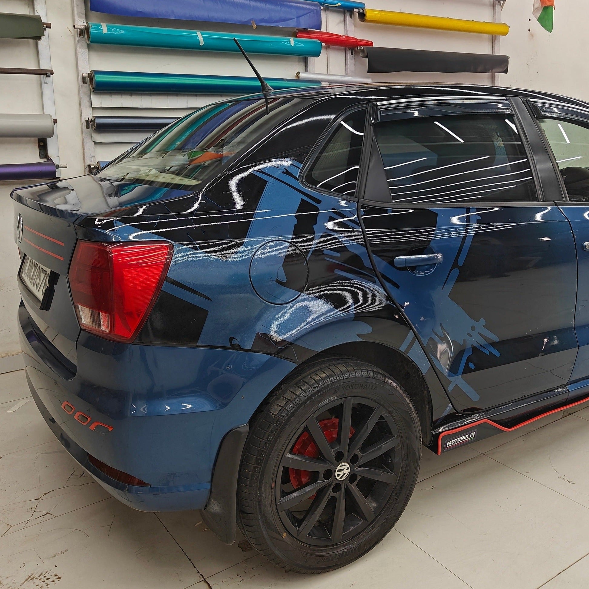 Vehicle featuring Motorik Detailing's double X graphics for vehicles in blue and black design