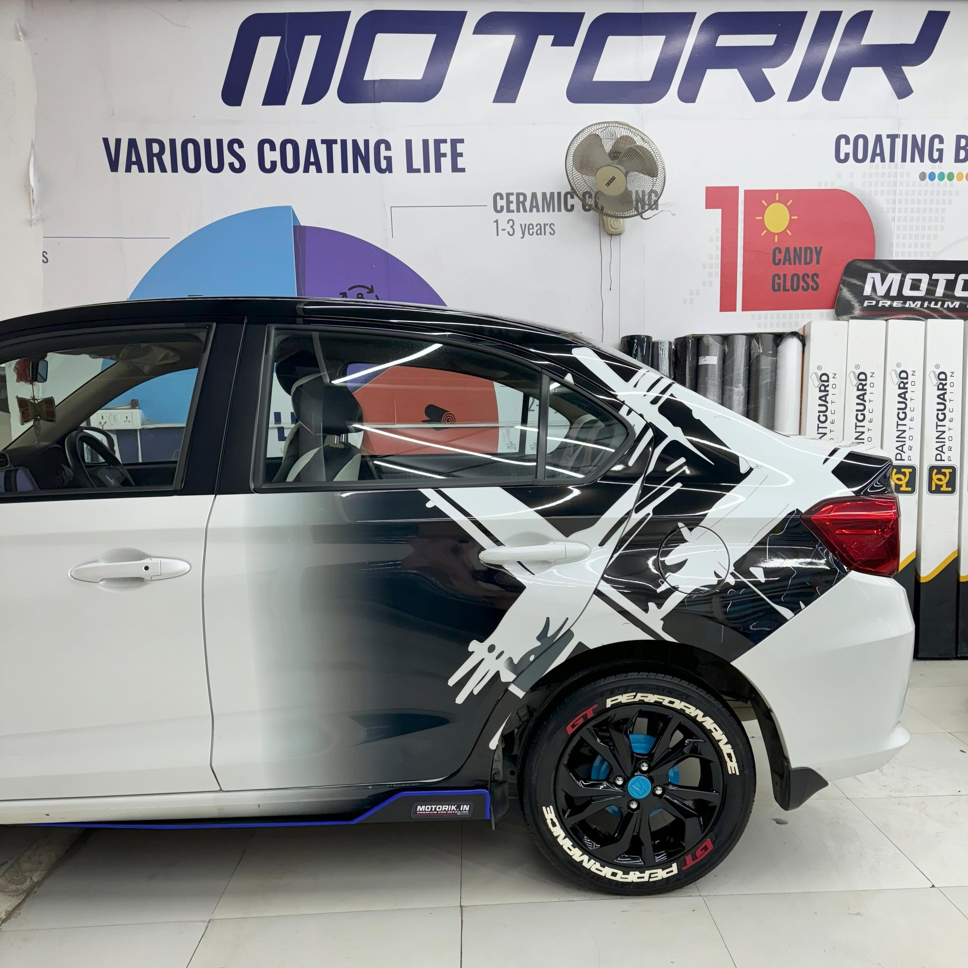 Double X graphics for vehicles on a sleek white car enhancing its sporty appearance