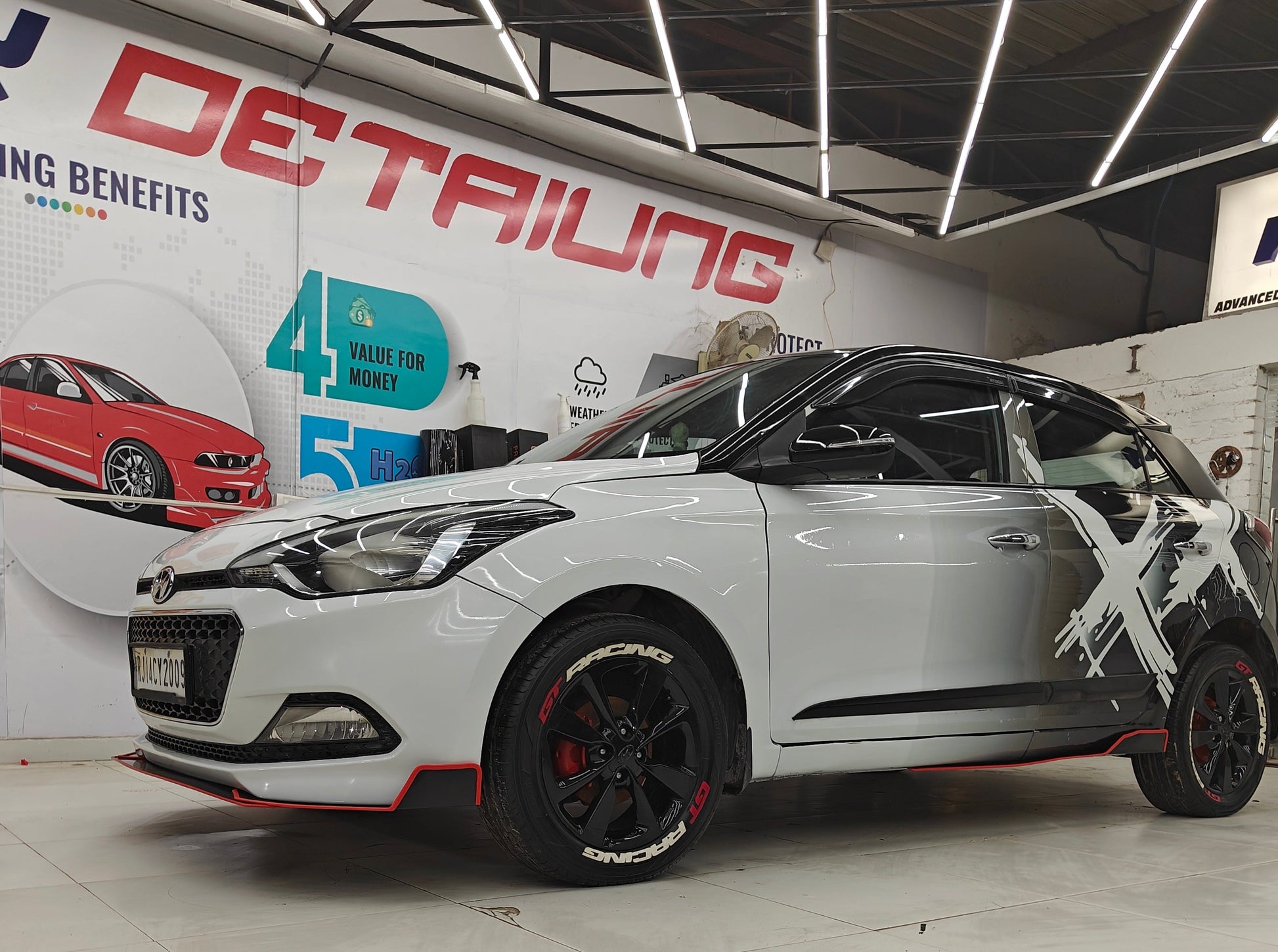 Hyundai car featuring double X graphics for vehicles, showcased in a Motorik Detailing shop setting