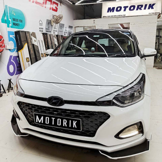 Car front bumper protectors 2 piece set installed on a white Hyundai vehicle for enhanced protection
