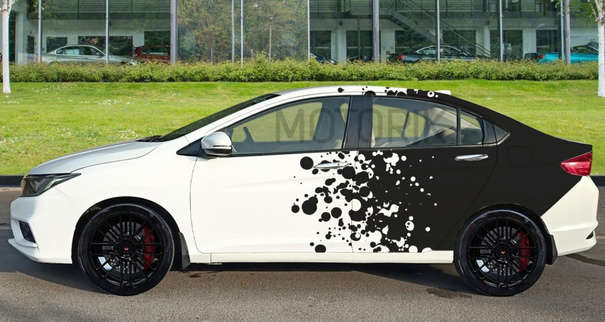 Stylish car with black and white particle distortion car graphics designed by Motorik Detailing