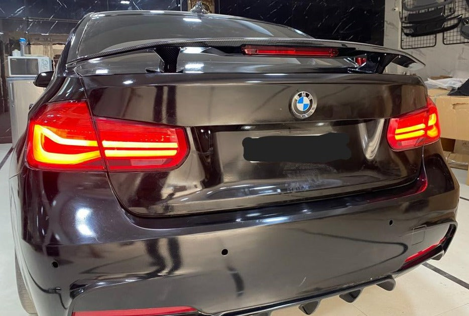 Premium car spoilers installed on a black BMW, enhancing aerodynamic performance and style