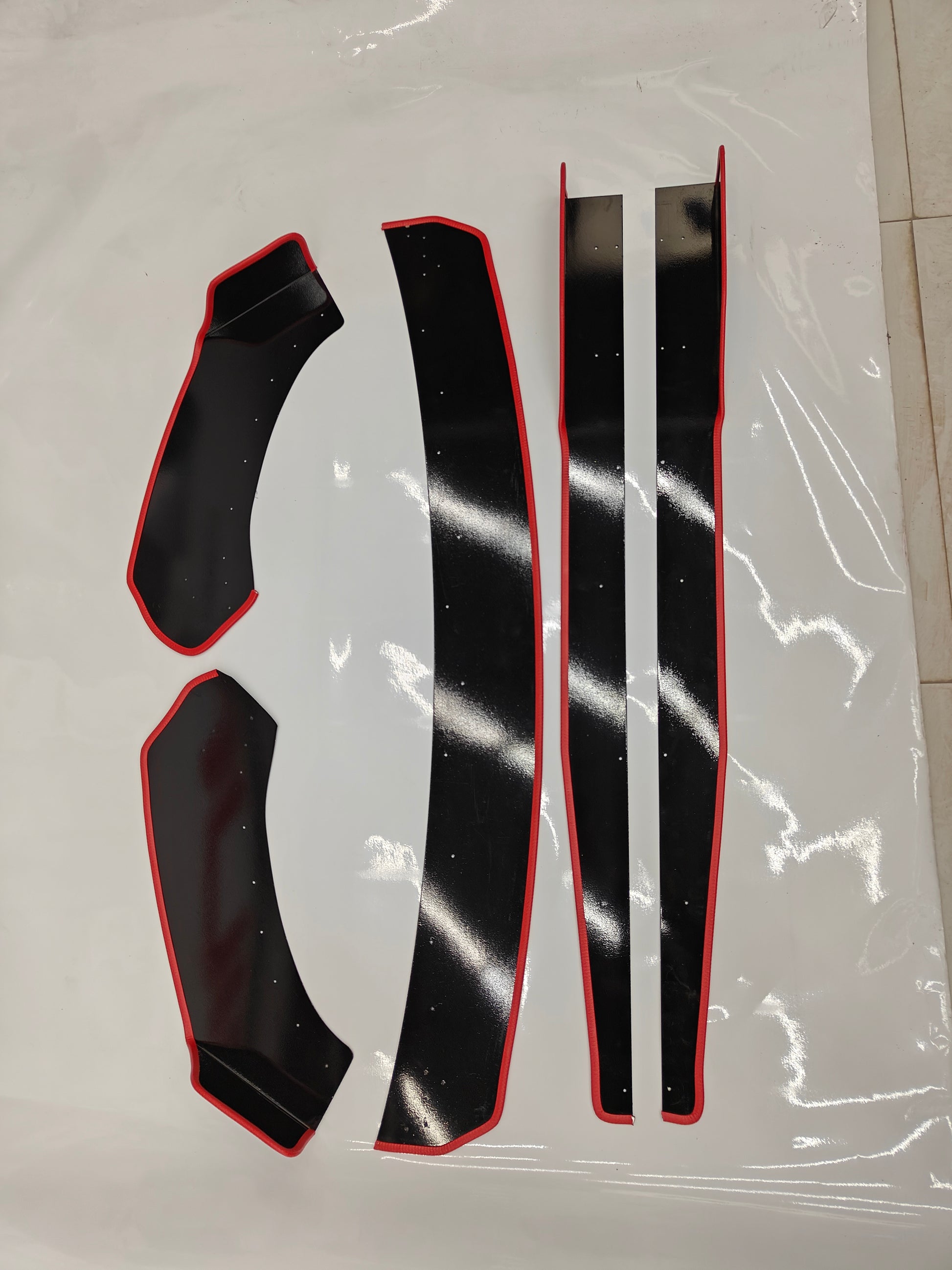 Set of 5 Motorik Detailing Skoda Slavia splitters with a sleek black finish and red accents