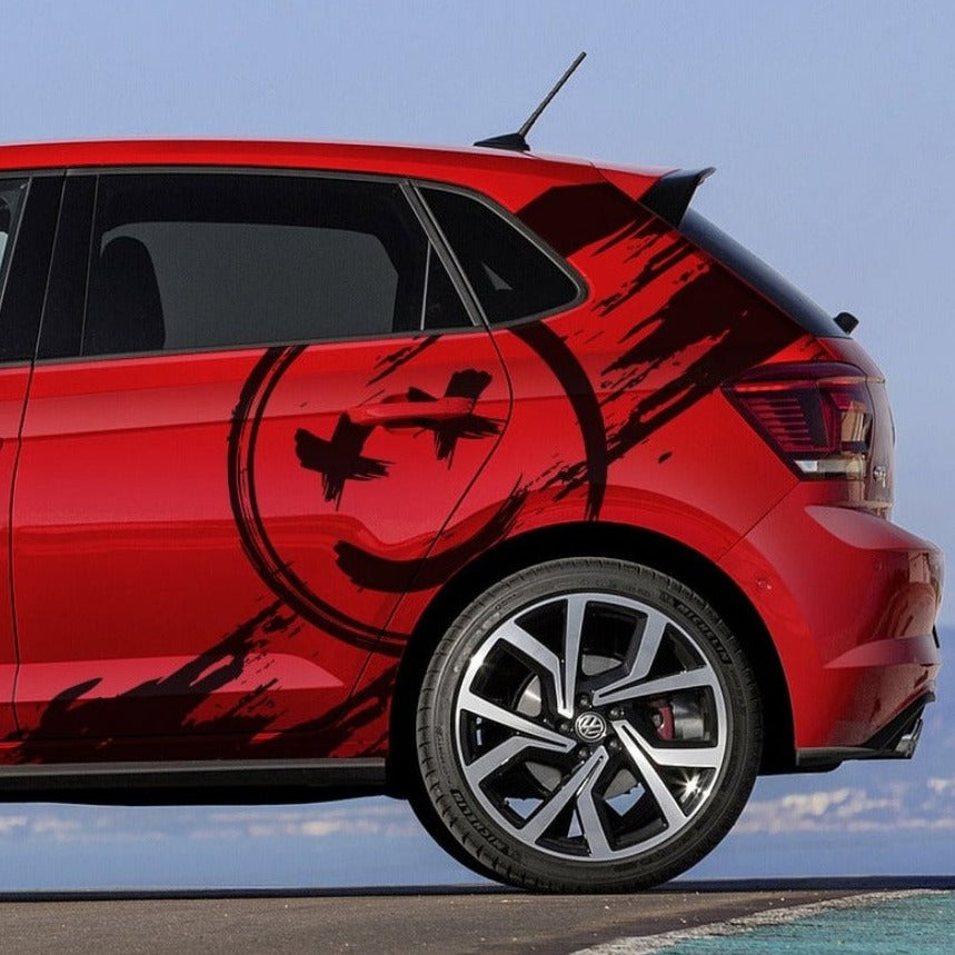 Vibrant red hatchback car featuring smile car Graphic design on the side for a unique look